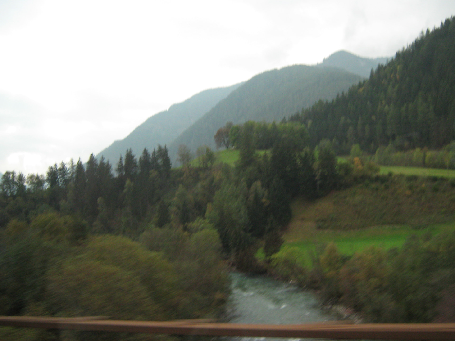 River Beneath Forested Mountains · বনঘেরা পাহাড়ের পাদদেশে নদী, Italy